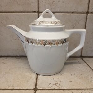 Elegant White and Gold Teapot